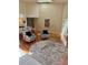 Bright living room boasts high ceilings, wood floors, a skylight, and an open floor plan at 4404 Calle Serena, Sarasota, FL 34238