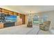 Open living room with built-in storage and shelves, plus large windows offering scenic views at 4404 Calle Serena, Sarasota, FL 34238
