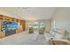 Spacious living room featuring built-in shelving, large windows, and comfortable seating at 4404 Calle Serena, Sarasota, FL 34238