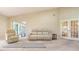 Open living room with bright airy floor plan, comfy furniture, and access to the sunroom at 4404 Calle Serena, Sarasota, FL 34238