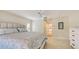Spacious main bedroom with a king bed, neutral colors, and an en-suite bath entrance at 4404 Calle Serena, Sarasota, FL 34238