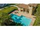 Beautiful swimming pool with plenty of lounge seating and a pool house at 4404 Calle Serena, Sarasota, FL 34238