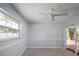 Bedroom featuring neutral walls, ceiling fan, sliding glass doors, and carpet at 4453 Meadow Creek Cir, Sarasota, FL 34233