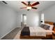 Spacious bedroom with ceiling fan and neutral carpeting at 4453 Meadow Creek Cir, Sarasota, FL 34233