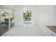 Sunlit dining area with sliding glass doors to the pool at 4453 Meadow Creek Cir, Sarasota, FL 34233