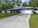 Charming single Gathering home with a well-manicured lawn and an attached two-car garage at 4453 Meadow Creek Cir, Sarasota, FL 34233