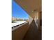 Long balcony overlooking the carport with a blue sky overhead at 4460 Fairways Blvd # 304, Bradenton, FL 34209