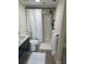 Stylish bathroom featuring a modern vanity, a shower with a sleek black showerhead, and wood-look flooring at 4460 Fairways Blvd # 304, Bradenton, FL 34209