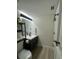 Modern bathroom featuring a sleek vanity, illuminated mirror, and updated fixtures at 4460 Fairways Blvd # 304, Bradenton, FL 34209