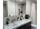 Elegant bathroom featuring double sinks, a sleek vanity, and modern fixtures at 4460 Fairways Blvd # 304, Bradenton, FL 34209