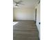 Bright bedroom featuring sleek wood floors, a ceiling fan, and fresh white walls at 4460 Fairways Blvd # 304, Bradenton, FL 34209