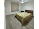 Well-lit bedroom with a ceiling fan, blind-covered window, and comfortable bed at 4460 Fairways Blvd # 304, Bradenton, FL 34209