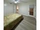Bedroom with wood-look floors, white doors, and a comfortable bed at 4460 Fairways Blvd # 304, Bradenton, FL 34209