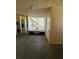 Hallway with an open area to the outside and durable flooring at 4460 Fairways Blvd # 304, Bradenton, FL 34209