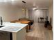 Open living space featuring a kitchen, dining area, living room, and workspace with neutral tones and modern fixtures at 4460 Fairways Blvd # 304, Bradenton, FL 34209