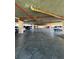 Wide-angle view of an indoor parking garage with multiple parking spaces available at 4460 Fairways Blvd # 304, Bradenton, FL 34209