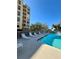 A refreshing pool with lounge chairs and tables for residents to enjoy at 4460 Fairways Blvd # 304, Bradenton, FL 34209