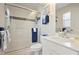 Bathroom featuring a glass enclosed shower and modern white fixtures at 4464 Mcintosh Lake Ave, Sarasota, FL 34233