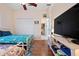 bedroom with decorative wall art, wood-look flooring, two twin beds, and a ceiling fan at 4464 Mcintosh Lake Ave, Sarasota, FL 34233