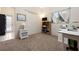 Bedroom featuring neutral carpet, closet, and desk with workspace for home office at 4464 Mcintosh Lake Ave, Sarasota, FL 34233