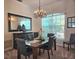 Formal dining room with an elegant chandelier and carpeted floor at 4464 Mcintosh Lake Ave, Sarasota, FL 34233