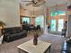 Open-concept living area showcases a dining table, an adjacent foyer, and comfortable lounge seating at 4464 Mcintosh Lake Ave, Sarasota, FL 34233