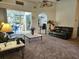Inviting living area with comfortable sofas, sliding glass doors to pool, and easy access to other rooms at 4464 Mcintosh Lake Ave, Sarasota, FL 34233