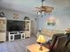 Comfortable living room with a ceiling fan and mounted television at 4464 Mcintosh Lake Ave, Sarasota, FL 34233