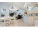 Bright, open living space featuring an eat-in dining area, kitchen, and comfortable seating at 4464 Mcintosh Lake Ave, Sarasota, FL 34233