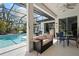 A covered patio area, with a view of the pool at 4464 Mcintosh Lake Ave, Sarasota, FL 34233