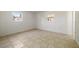 Bedroom featuring two windows, tile flooring, and a neutral color palette at 510 Marlin Dr, Punta Gorda, FL 33950