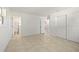 Open bedroom featuring tile flooring, closet space, and connections to the bathroom at 510 Marlin Dr, Punta Gorda, FL 33950