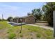 Landscaped exterior with a bright lamp post near the covered patio at 510 Marlin Dr, Punta Gorda, FL 33950