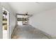 Empty garage with an open garage door, revealing the street and front yard at 510 Marlin Dr, Punta Gorda, FL 33950