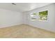 Bright and airy living room with neutral tile flooring, complemented by natural light from windows at 510 Marlin Dr, Punta Gorda, FL 33950