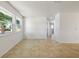 Spacious living room featuring tile flooring and natural light from two large windows at 510 Marlin Dr, Punta Gorda, FL 33950