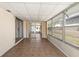 Bright enclosed sunroom with tiled floor and multiple windows for natural light at 510 Marlin Dr, Punta Gorda, FL 33950