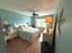 Bright bedroom with a cozy bed, matching nightstands, ample natural light, and ceiling fan at 515 30Th W Ave # H303, Bradenton, FL 34205