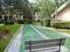 Outdoor shuffleboard courts with benches for relaxation and recreation at 515 30Th W Ave # H303, Bradenton, FL 34205