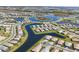 Stunning aerial view of a Primary-planned community with lakes, lush landscaping, and single-Gathering homes at 5311 White Sand Cv, Bradenton, FL 34211