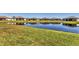 Scenic backyard featuring a serene lake view and lush greenery at 5311 White Sand Cv, Bradenton, FL 34211