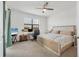 Comfortable bedroom with neutral décor offers ample space for relaxation and productivity at 5311 White Sand Cv, Bradenton, FL 34211