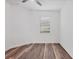 Clean bedroom offers a ceiling fan, a window, and wood flooring at 5311 White Sand Cv, Bradenton, FL 34211