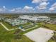 Aerial shot showcasing community amenities: swimming pool, clubhouse, bocce ball court, volleyball court at 5311 White Sand Cv, Bradenton, FL 34211