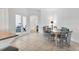 Dining area boasts abundant natural light with views into the living area at 5311 White Sand Cv, Bradenton, FL 34211