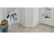 Inviting entryway featuring neutral tile flooring and provides an open view into the main living areas at 5311 White Sand Cv, Bradenton, FL 34211