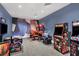 Game room features a variety of arcade machines and vibrant wall art for entertainment at 5311 White Sand Cv, Bradenton, FL 34211