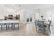 Bright kitchen and dining area with stainless steel appliances and breakfast bar at 5311 White Sand Cv, Bradenton, FL 34211
