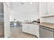 Bright open kitchen with stainless steel appliances and granite counters offers ample dining space at 5311 White Sand Cv, Bradenton, FL 34211
