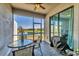 Enclosed lanai featuring views of the pond and an outdoor dining and grilling space at 5311 White Sand Cv, Bradenton, FL 34211